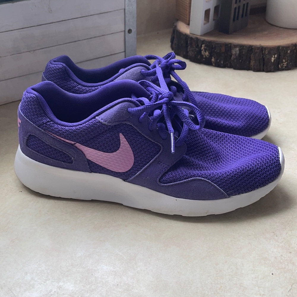Purple Nikes with pink accents